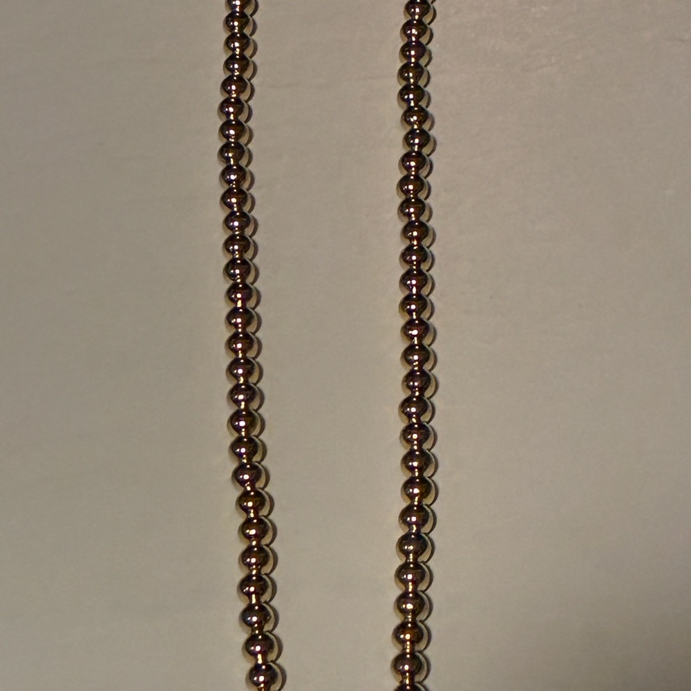 Gold tone sexy ball necklace not sure the metal but it very pretty